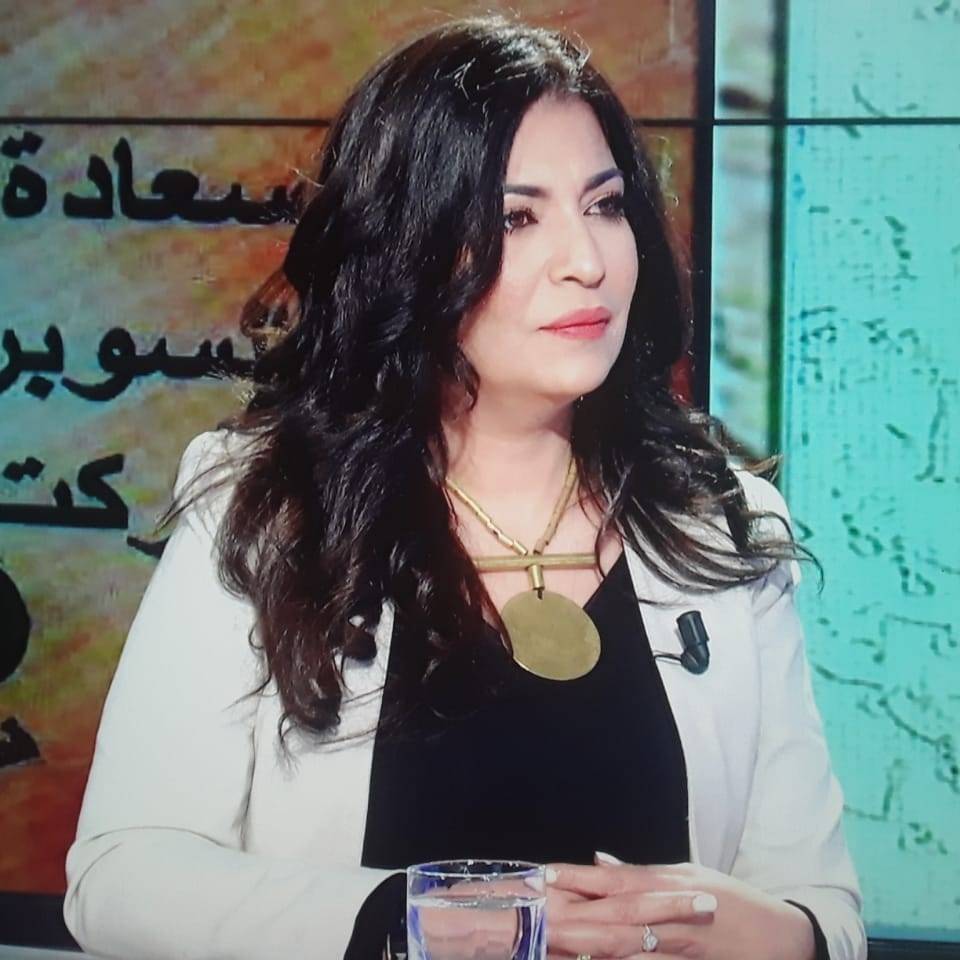 Portrait of author Doha Assi